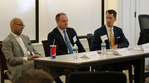 Eric Kauders '91, Harold Eylward '98, and Karim Ahamed '79 lead a session on Private Banking