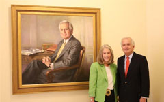 Ed Tokar and Nancy Fleming Harris with painting