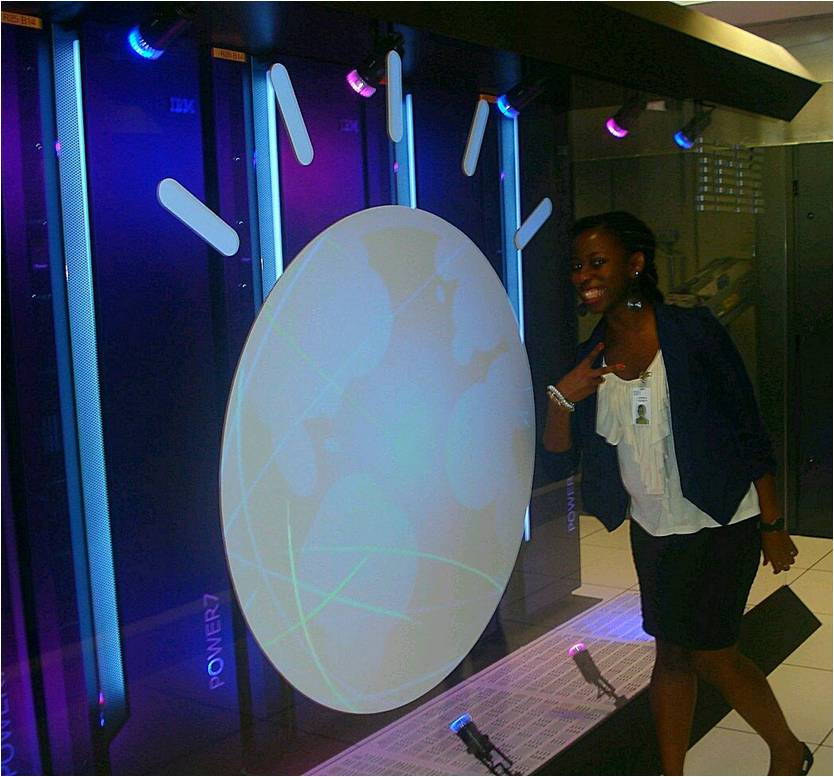 Cynthia Lutaaya '15 poses with IBM's Watson