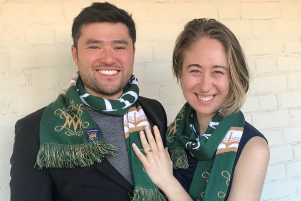 Isabel and Jonny wearing William & Mary scarfs