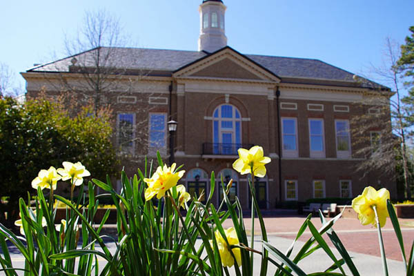 Miller Hall with yellow flowers