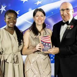 Chelsea Mandello EMBA '21 (Center) wins National Entrepreneur of the Year Award 