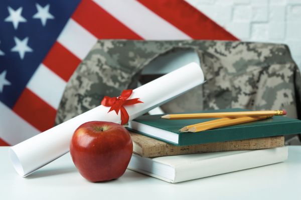 Generic image of apple, diploma, flag, and military uniform